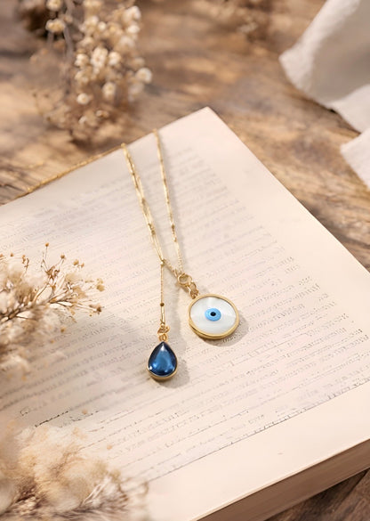 Gold Evil Eye Pendant with Blue Crystal Drop