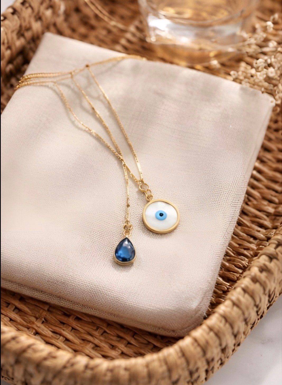 Gold Evil Eye Pendant with Blue Crystal Drop