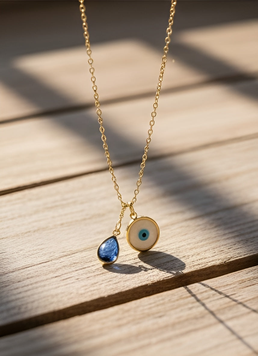 Gold Evil Eye Pendant with Blue Crystal Drop
