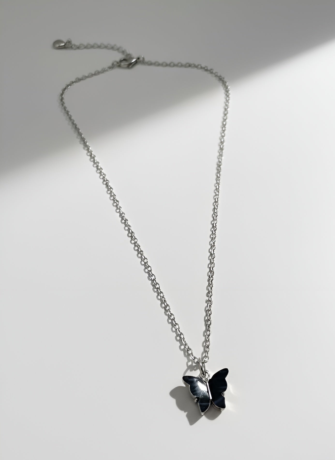 Black Butterfly Pendant Necklace in Silver Tone